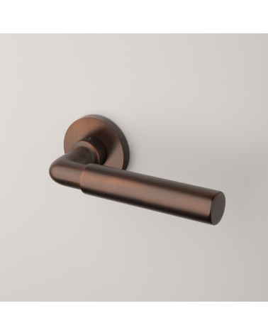 Poignée de porte brun foncé mat FICARIA poignée design sur fond gris