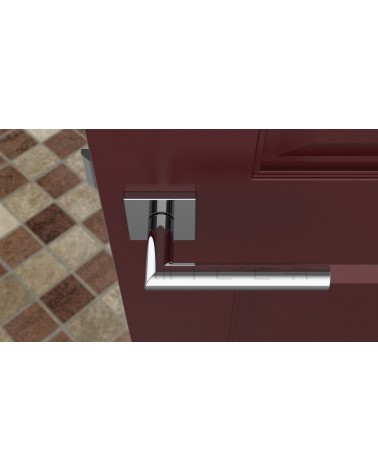 Poignée de porte chrome poli ARABIS poignée design vue de haut montée sur une porte