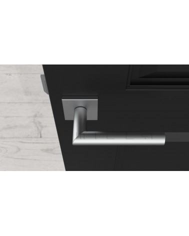 Poignée de porte chrome satiné ARABIS quincaillerie design vue de haut montée sur une porte