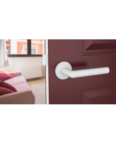 Poignée de porte couleur blanche ARABIS poignée design vue de haut inclinée montée sur une porte