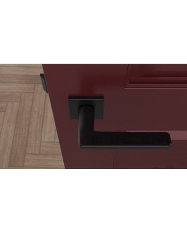 Poignée de porte noire SETIA poignée design vue de haut montée sur une porte