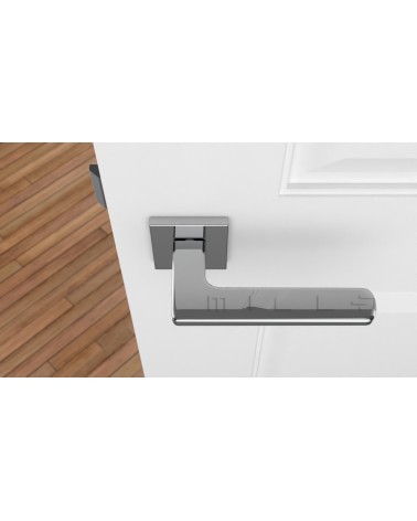 Poignée de porte chrome poli YUKA quincaillerie design vue de haut montée sur une porte