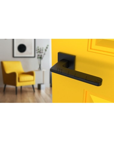 Poignée de porte moderne YUKA poignée design vue de haut inclinée montée sur une porte