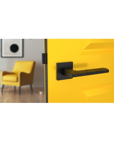 Poignée de porte moderne YUKA poignée design vue de face montée sur une porte