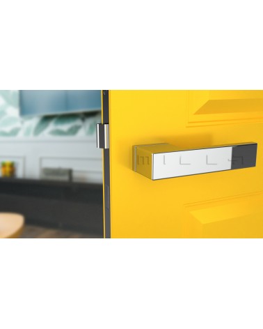 Poignée de porte chrome poli CARLINA poignée design vue de face montée sur une porte