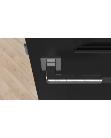 Poignée de porte chrome poli SALICE quincaillerie design vue de haut montée sur une porte