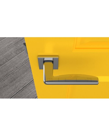 Poignée de porte chrome poli ERBA poignée design vue de haut montée sur une porte