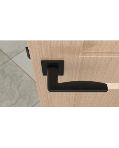 Poignée de porte noire ERBA poignée design vue de haut montée sur une porte