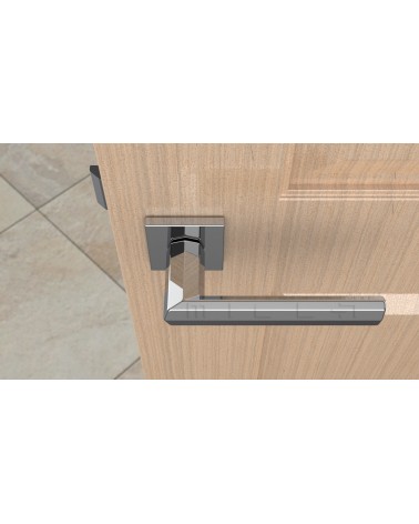 Poignée de porte chrome poli FRESIA poignée design vue de haut montée sur une porte