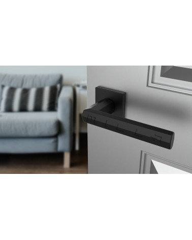 Poignée de porte moderne FRESIA poignée design vue de haut inclinée montée sur une porte