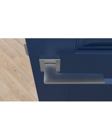 Poignée de porte chrome satiné LUNARIA poignée design vue de haut montée sur une porte