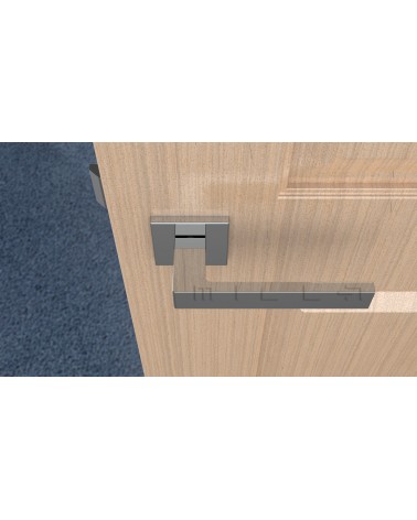 Poignée de porte chrome poli SULLA poignée design vue de haut montée sur une porte