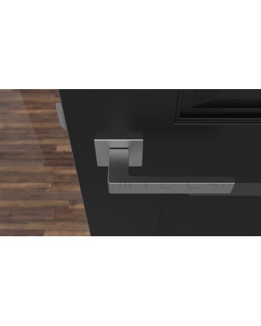 Poignée de porte chrome satiné SULLA poignée design vue de haut montée sur une porte
