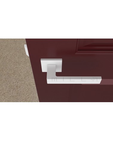 Poignée de porte blanche SULLA poignée design vue de haut montée sur une porte