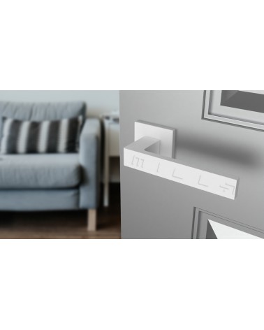 Poignée de porte blanche SULLA poignée design vue de haut inclinée montée sur une porte