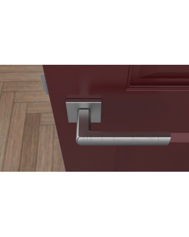 Poignée de porte chrome satiné HOSTA quincaillerie design vue de haut montée sur une porte