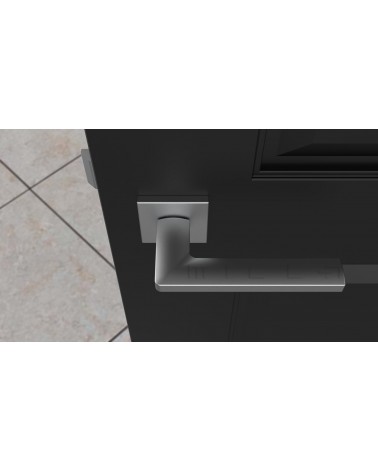 Poignée de porte chrome satiné PYROLA quincaillerie design vue de haut montée sur une porte