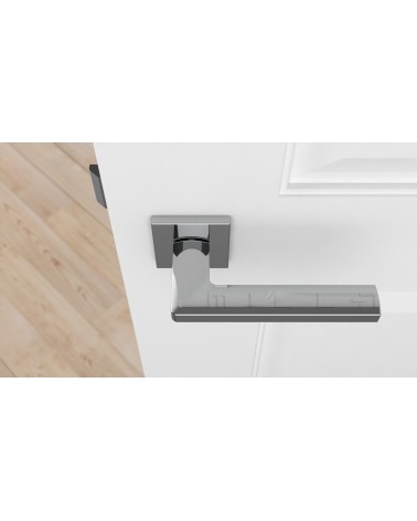 Poignée de porte classique PYROLA quincaillerie design vue de haut montée sur une porte