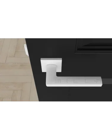 Poignée de porte PYROLA quincaillerie design couleur 4 vue de haut montée sur une porte