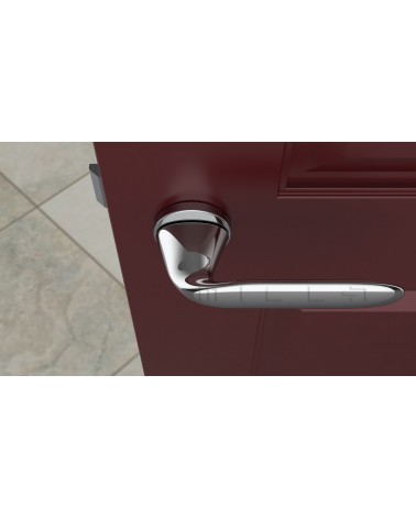Poignée de porte chrome poli PEONIA poignée design vue de haut montée sur une porte