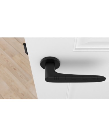 Poignée de porte noire ROSA poignée design vue de haut montée sur une porte