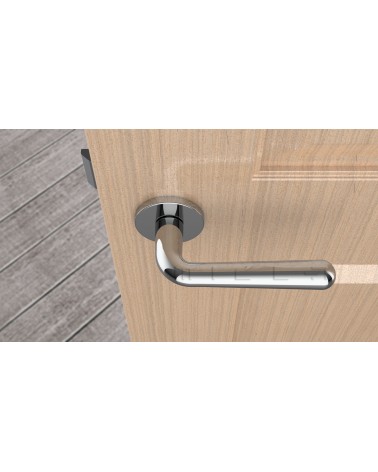 Poignée de porte chrome poli IRGA poignée design vue de haut montée sur une porte