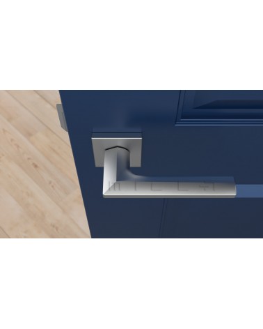 Poignée de porte chrome satiné JASMINA poignée design vue de haut montée sur une porte