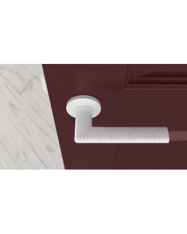 Poignée de porte blanche KALMIA poignée design vue de haut montée sur une porte