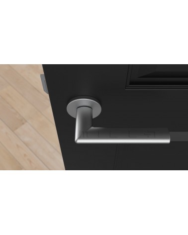 Poignée de porte chrome satiné KALMIA poignée design vue de haut montée sur une porte
