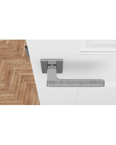 Poignée de porte en chrome poli LARICE poignée design vue de haut montée sur une porte