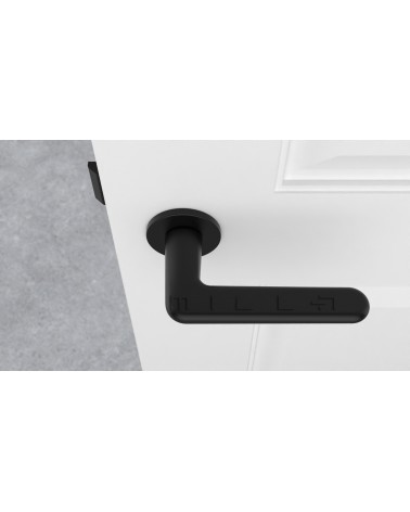 Poignée de porte noire LIRA poignée design vue de haut montée sur une porte