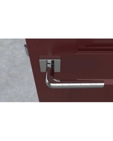 Poignée de porte chrome poli MELA poignée design vue de haut montée sur une porte