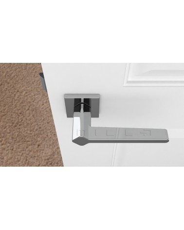 Poignée de porte couleur chrome poli NINFEA poignée design vue de haut  montée sur une porte