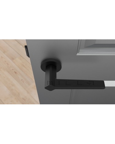 Poignée de porte noire NINFEA quincaillerie design vue de haut montée sur une porte