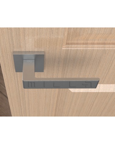 Poignée de porte chrome brossé Apollo poignée design vue de haut montée sur une porte