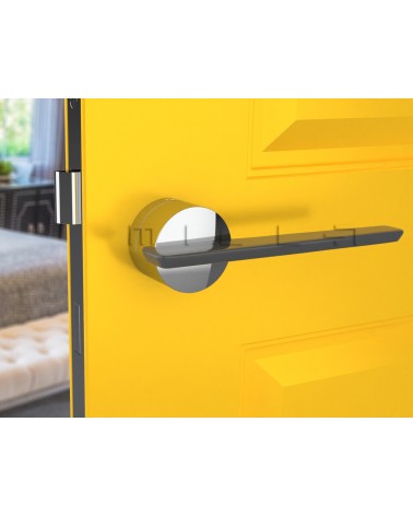 Poignée de porte bicolore JUMELLE poignée design vue de face montée sur une porte