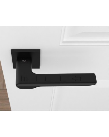 Poignée de porte noire LIGNE poignée design vue de haut montée sur une porte