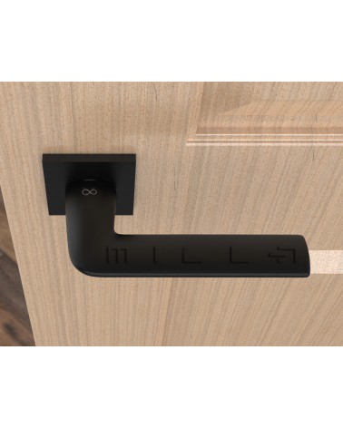 Poignée de porte noire STINGER poignée design vue de haut montée sur une porte