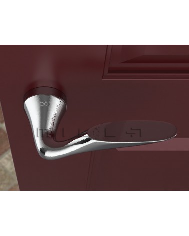 Poignée de porte chrome poli DOUCE poignée design vue de haut montée sur une porte