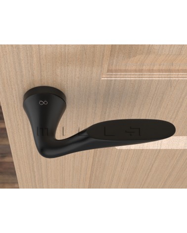 Poignée de porte noire DOUCE poignée design vue de haut montée sur une porte