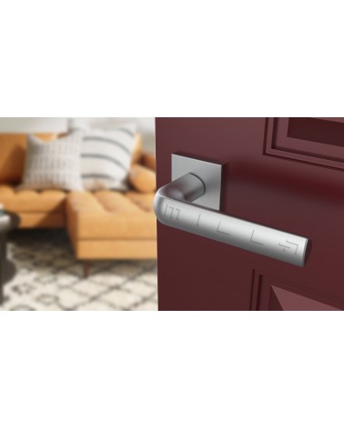 Poignée de porte en zamak MELA quincaillerie design couleur 2 vue de haut inclinée montée sur une porte