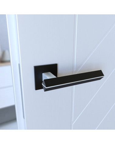 Poignée de porte en zamak CARRERA poignée design couleur 1 montée sur une porte vue inclinée