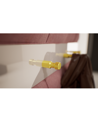 Bouton de meuble or mat GRETA poignée design fixé sur une surface blanche