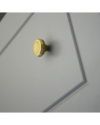 Bouton de meuble or mat CAMPANA poignée design fixé sur un meuble