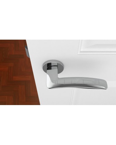 Poignée de porte en zamak ROBINE quincaillerie design couleur 3 montée sur une porte