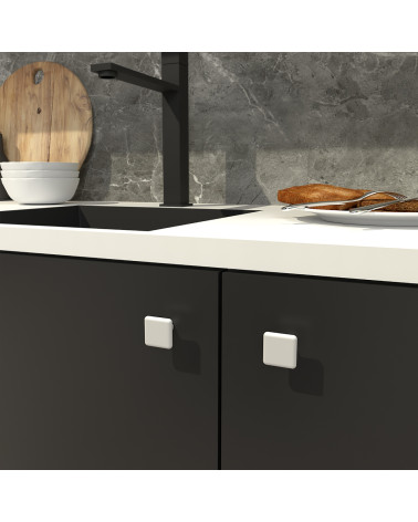 Bouton de meuble blanc NOX poignée design fixé sur un meuble
