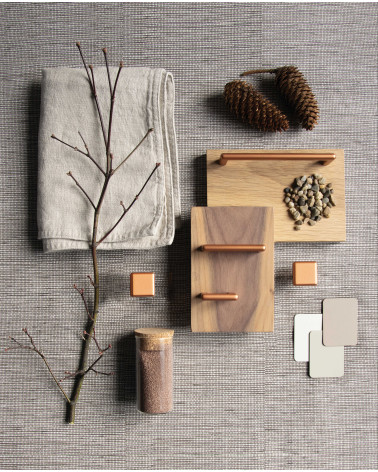 Bouton de meuble cuivre NOX poignée design disposée avec des matériaux décoratifs