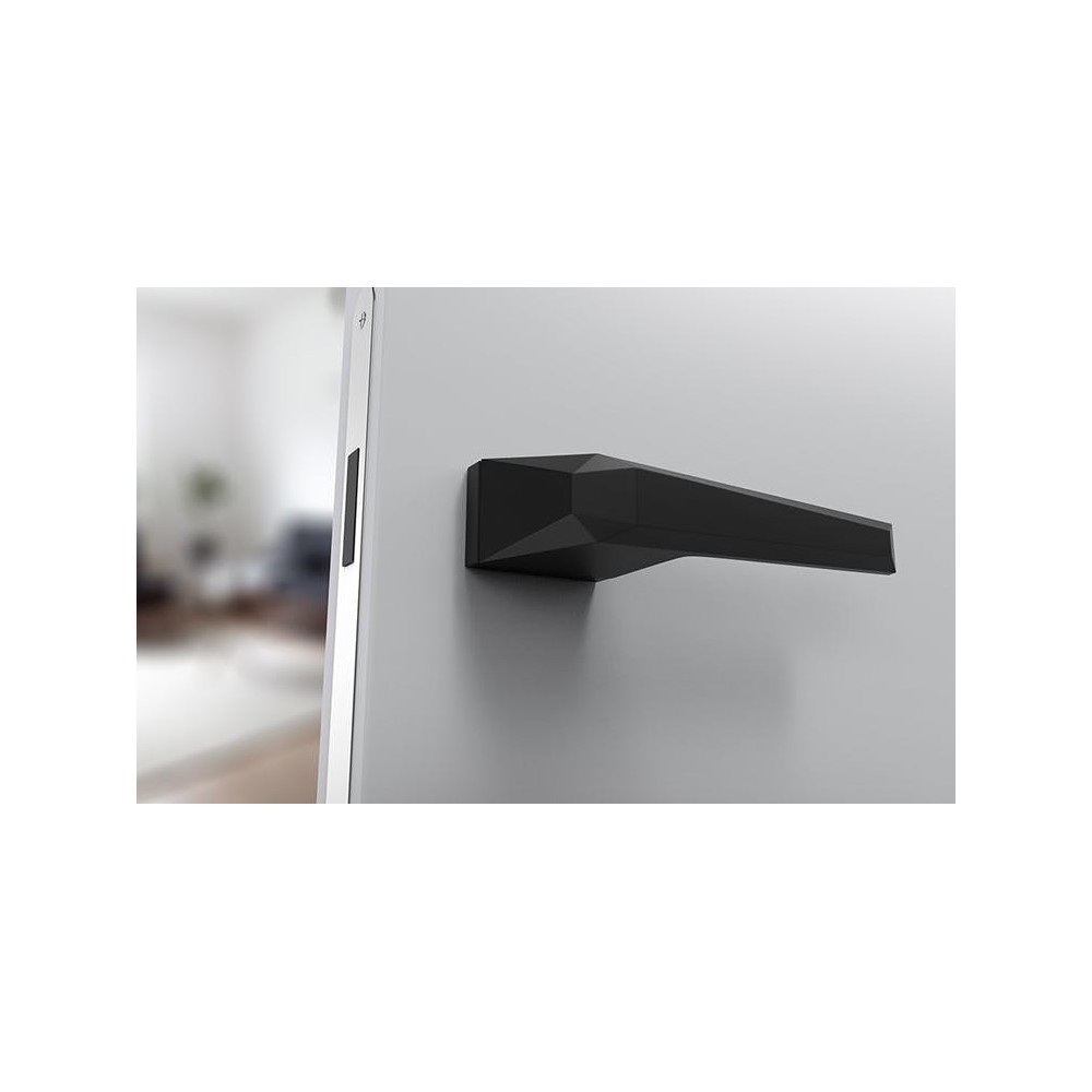 poignée de porte noire mate futuriste sur une porte blanche
